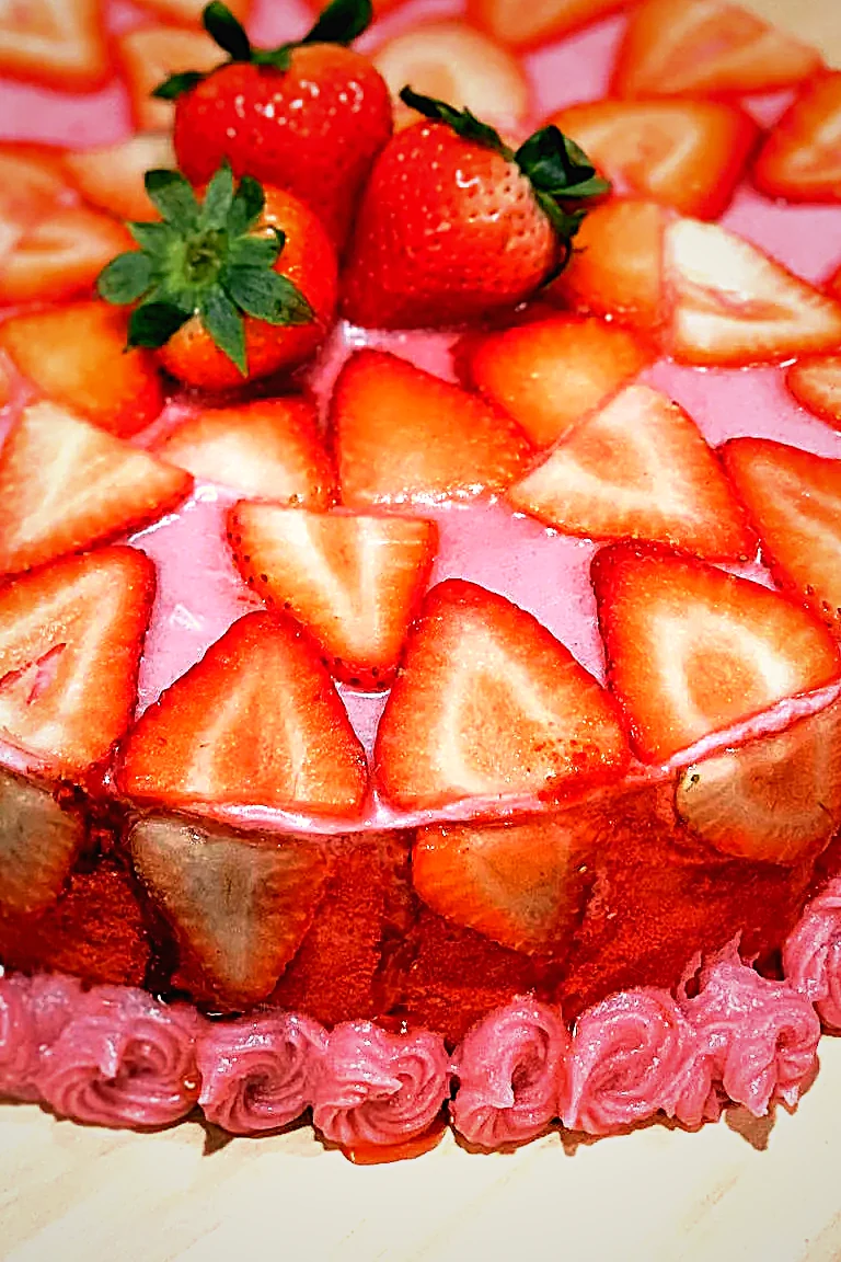 A strawberry entremet under a mirror glaze