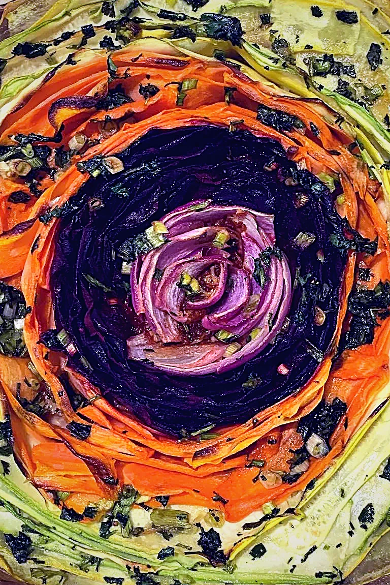 A vegetable spiral tart, arranged colour by colour
